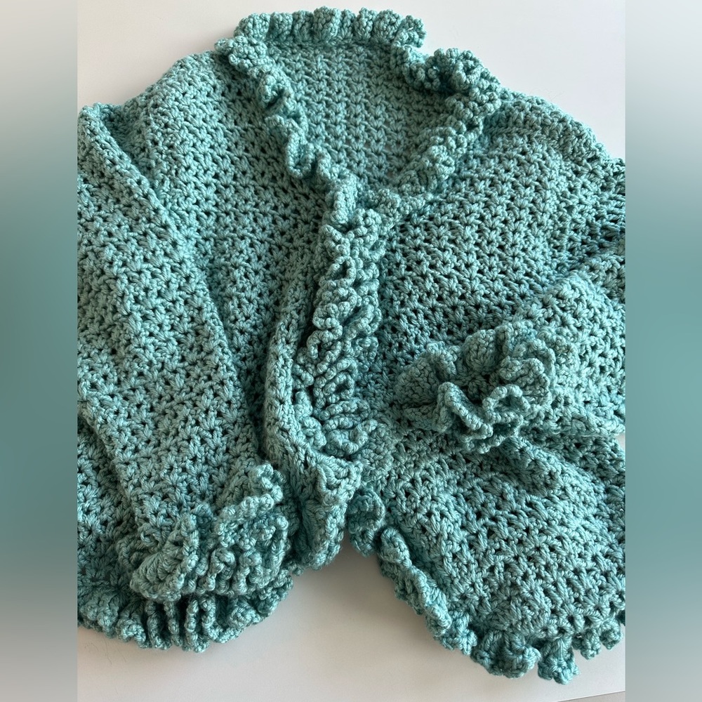 Handmade turquoise cardigan with ruffles and 2 snap closure